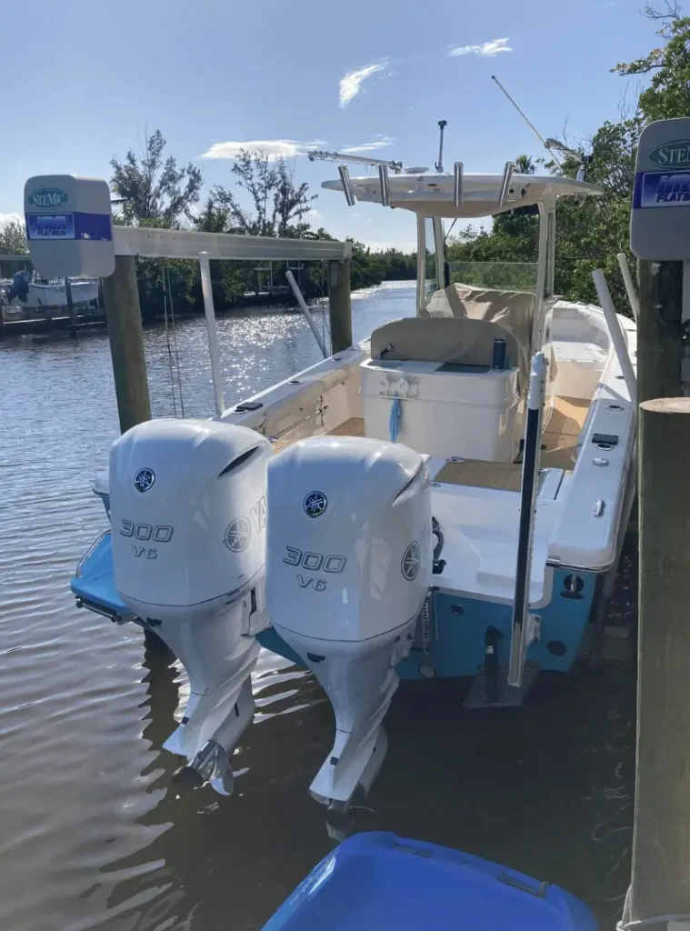Twin Yamaha 300 V6 outboards on a docked center console boat in Southwest Florida ready for monthly Boat Watch service 759x1024 1